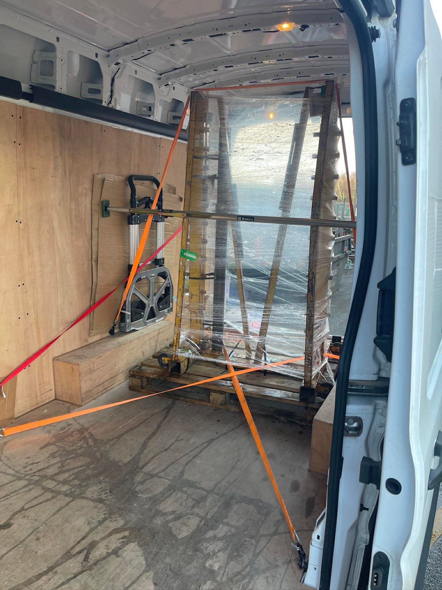 Large glass panes strapped in van